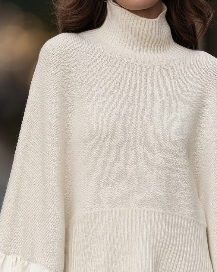 Beige dametrøje med rullekrave og lange ærmer med flæsekanter
