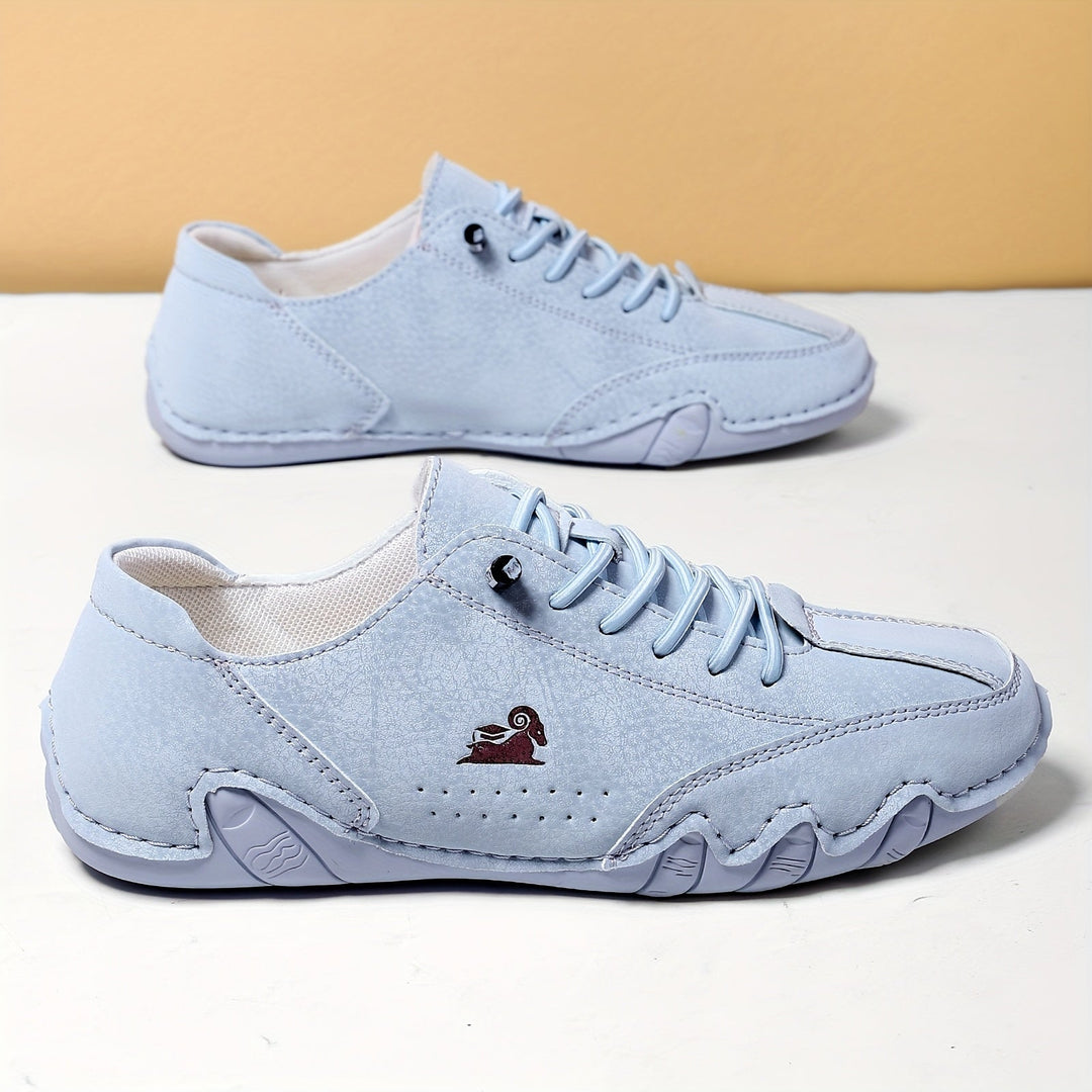 Unisex sneakers med snørebånd, rund tå og lav profil