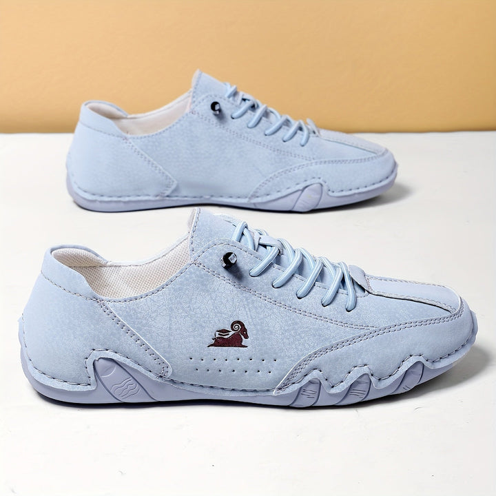 Unisex sneakers med snørebånd, rund tå og lav profil