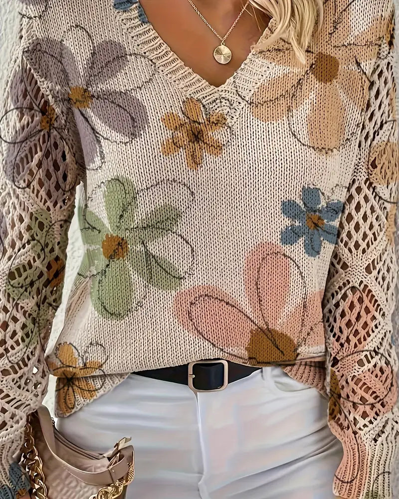 Flerfarvet dame-striktrøje med blomstermønster, V-hals og åbent strikmønster på ærmerne