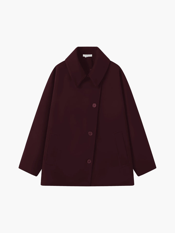Damefrakke med oversized pasform, stor krave, knapper og skrå lommer