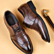 Herreloafers med blank finish og dekorativt metalbeslag