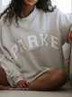 Damesweatshirt med oversized pasform, lange ærmer og stort tekstmotiv på fronten