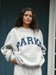 Damesweatshirt med oversized pasform, lange ærmer og stort tekstmotiv på fronten