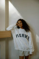 Damesweatshirt med oversized pasform, lange ærmer og stort tekstmotiv på fronten