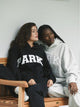 Damesweatshirt med oversized pasform, lange ærmer og stort tekstmotiv på fronten