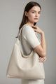 Rummelig dame shopper med lange skulderstropper og glat design