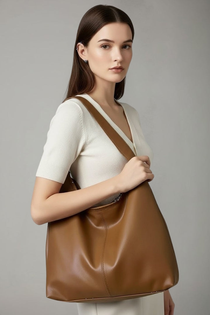 Rummelig dame shopper med lange skulderstropper og glat design