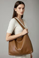 Rummelig dame shopper med lange skulderstropper og glat design