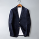 Herreblazer med ribbet struktur, revers, to knapper og lommer