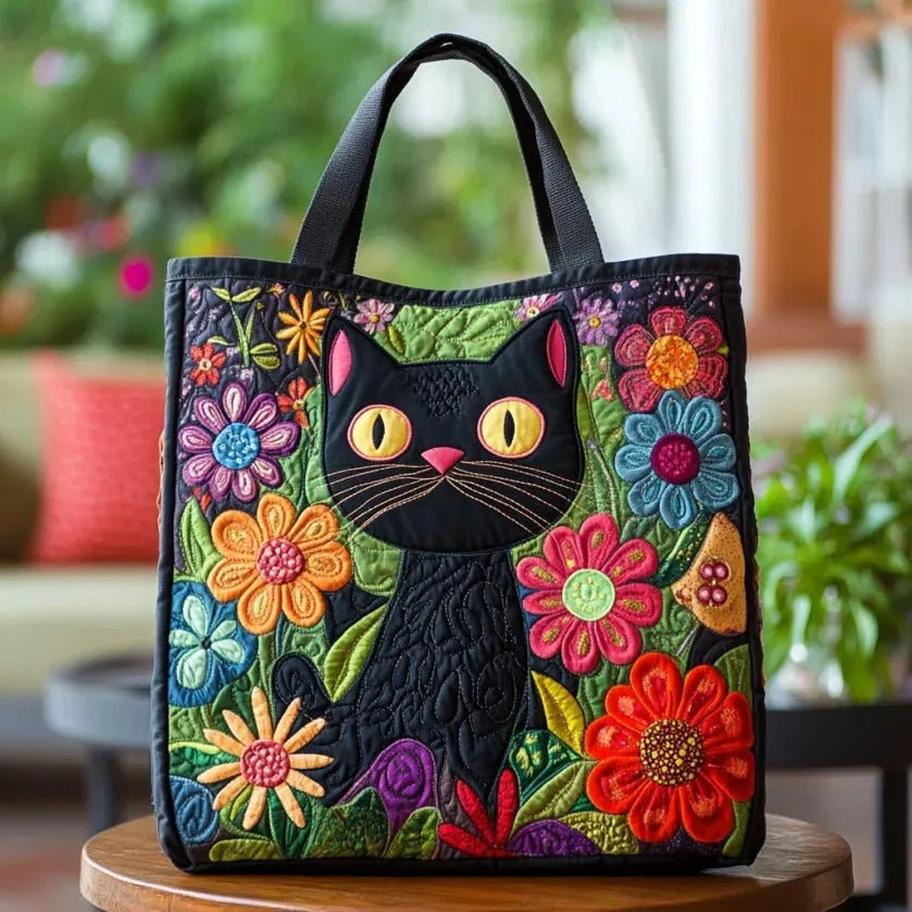 Quiltet shopper med dobbelt håndtag og dekorativt blomstret kunstmotiv