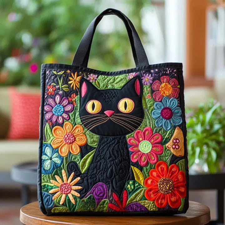 Quiltet shopper med dobbelt håndtag og dekorativt blomstret kunstmotiv