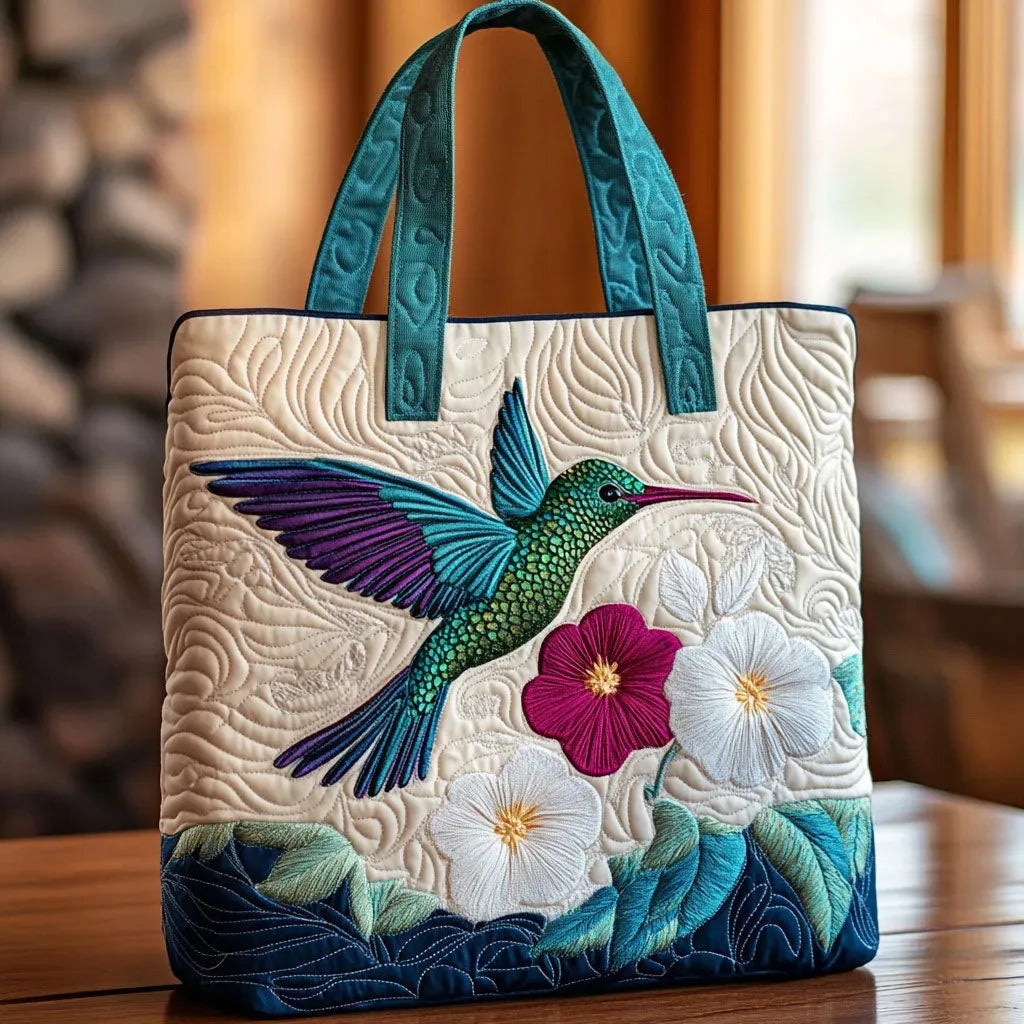 Quiltet shopper med dobbelt håndtag og dekorativt blomstret kunstmotiv