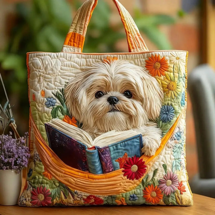 Quiltet shopper med dobbelt håndtag og dekorativt blomstret kunstmotiv