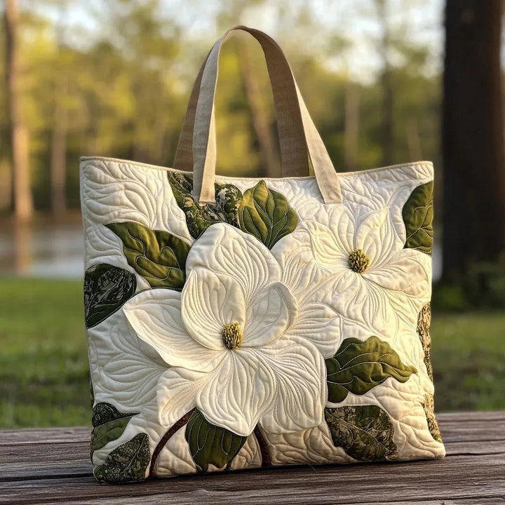 Quiltet shopper med dobbelt håndtag og dekorativt blomstret kunstmotiv