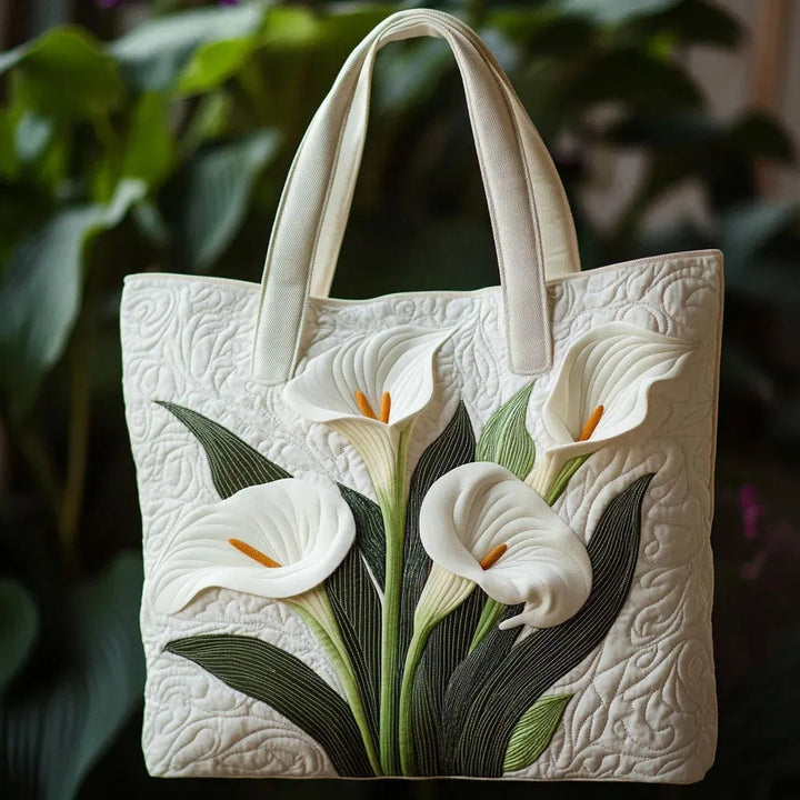 Quiltet shopper med dobbelt håndtag og dekorativt blomstret kunstmotiv