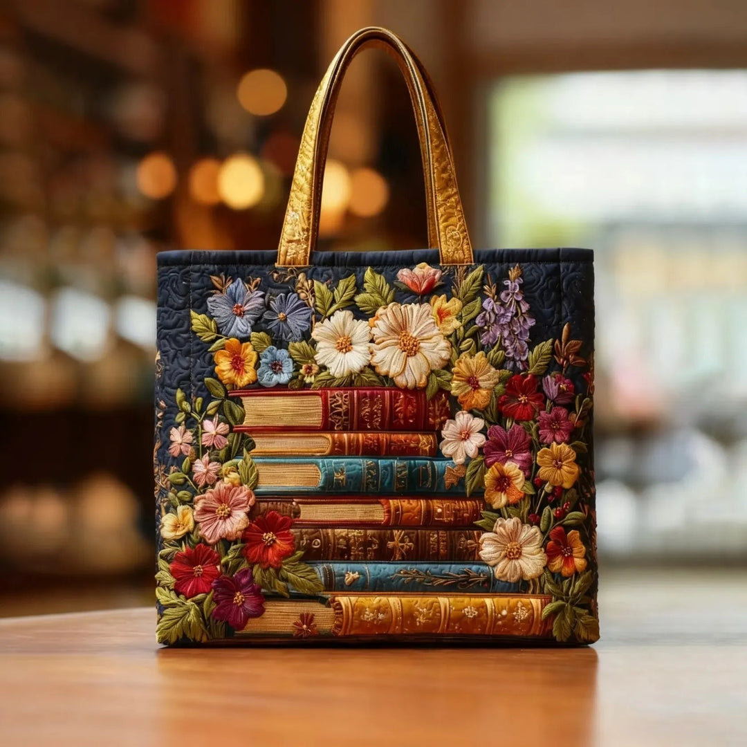 Quiltet shopper med dobbelt håndtag og dekorativt blomstret kunstmotiv