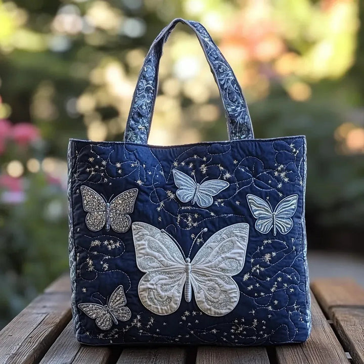 Quiltet shopper med dobbelt håndtag og dekorativt blomstret kunstmotiv
